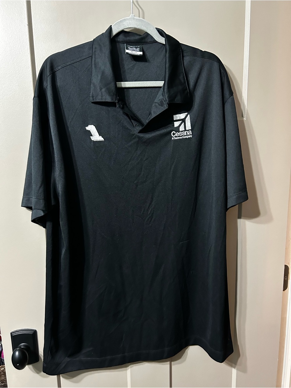 Nike golf Black Polo with White Cessna Aviation company Logo